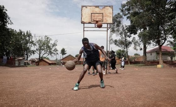 Refugee coach in Uganda mentors young players through basketball